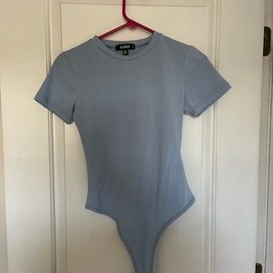 Purple missguided short sleeve body suit.